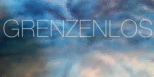 Text: Grenzenlos
Hintergrund: Reflektionen auf trüber Glasfläche